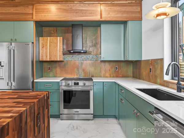 a kitchen with cabinets a sink and a stove