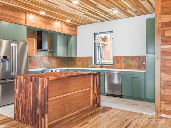 a kitchen with a refrigerator and a sink