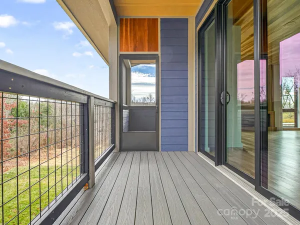 a view of outdoor space with wooden floor