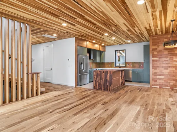 a view of a kitchen with wooden floor