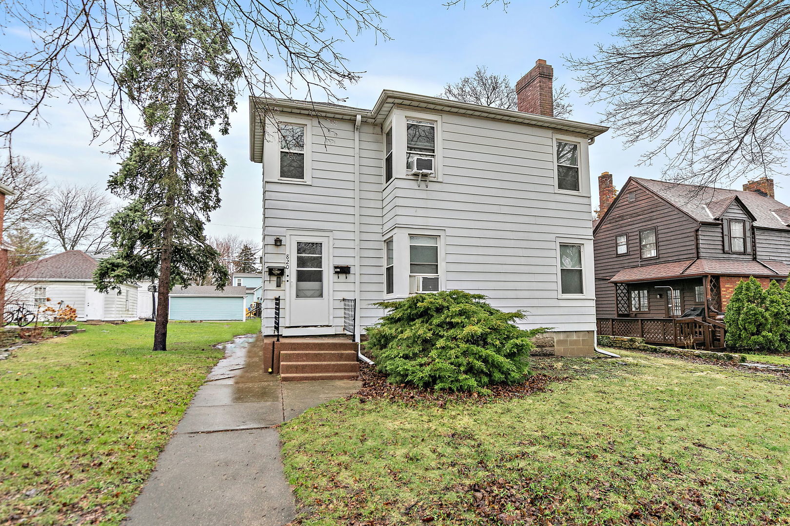 820 Lincoln Highway Rochelle, IL 61068 - Photo 1 of 27 a front view of a house with garden
