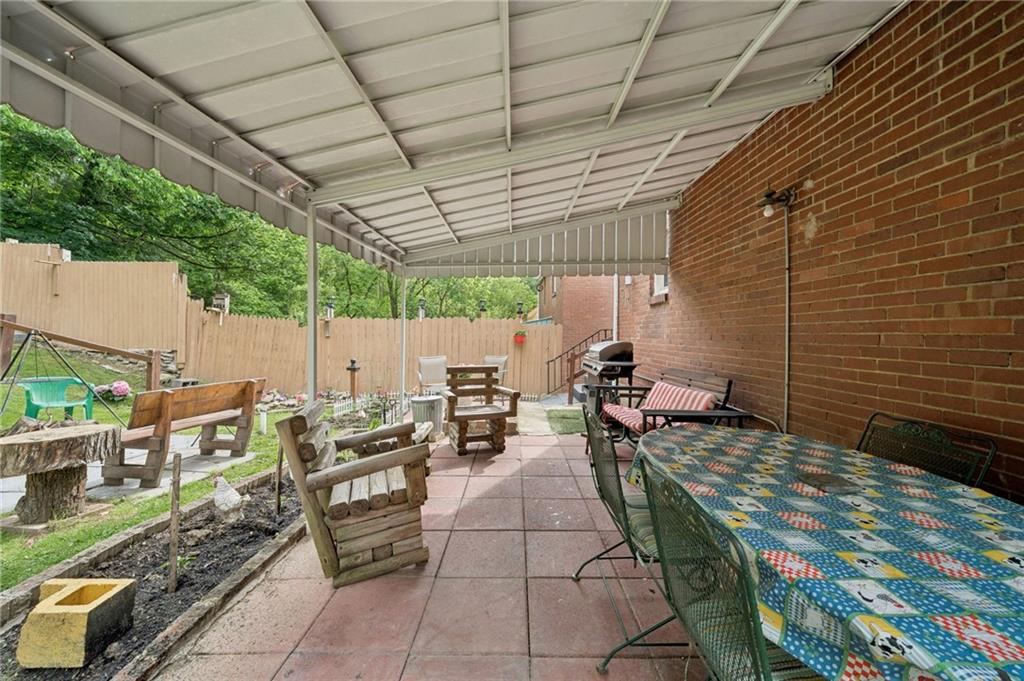 2106 Lindsay Road Pittsburgh, PA 15221 - Photo 32 of 36 The covered rear patio is accessed from the kitchen.