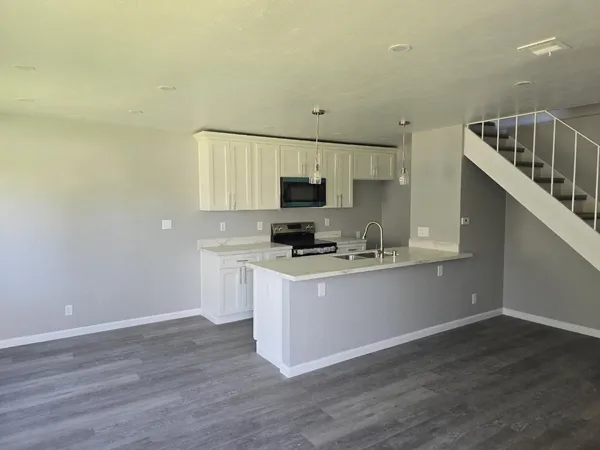 a kitchen with a stove and a microwave