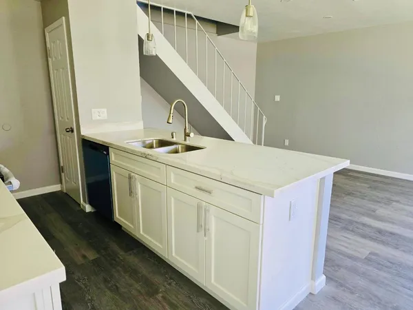 a utility room with faucet washer and dryer