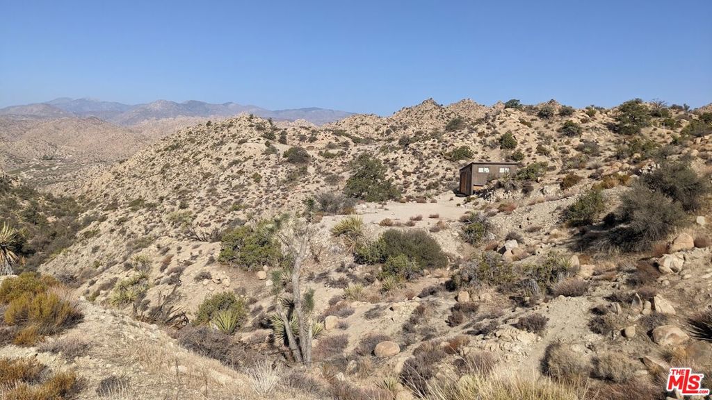 20 West Omega Trail Yucca Valley, CA 92286 - Photo 11 of 32 a view of a large building with mountains in the background