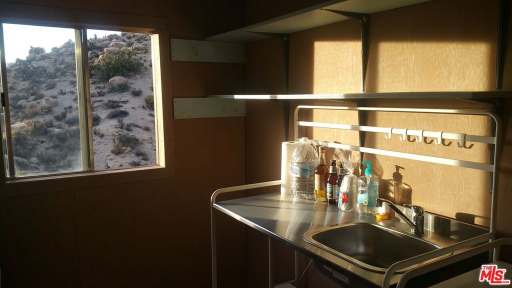 20 West Omega Trail Yucca Valley, CA 92286 - Photo 12 of 32 a bathroom with a sink and a mirror