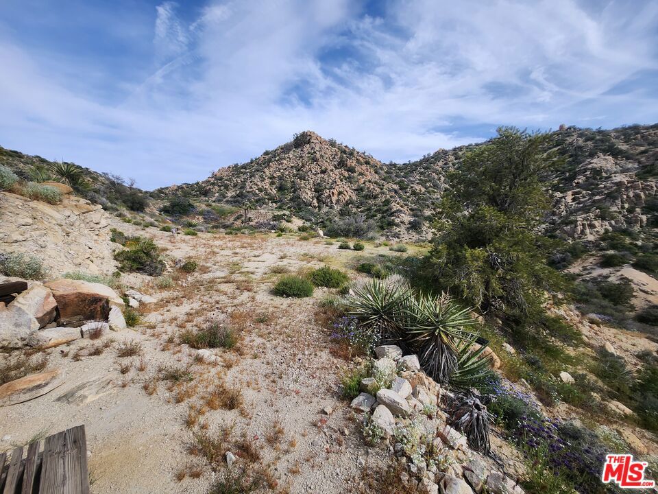 20 West Omega Trail Yucca Valley, CA 92286 - Photo 6 of 32 a view of a large building with mountains in the background