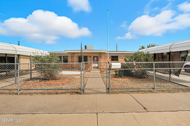 a view of a balcony with floor to ceiling windows