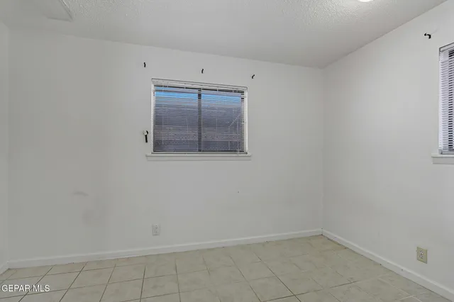 a view of a storage & utility room with washing machine