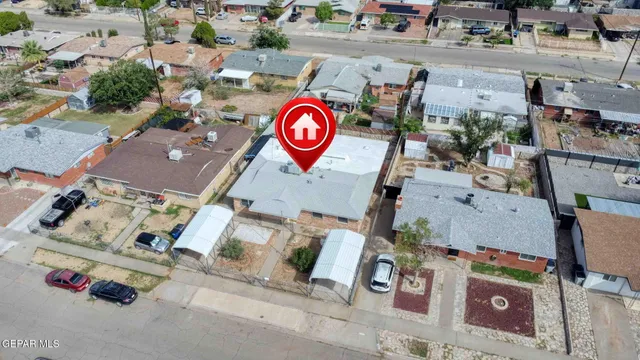 an aerial view of residential house with parking