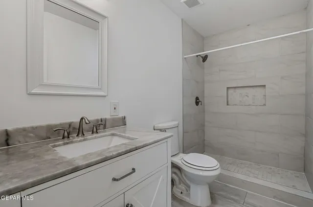 a view of a room with a book shelf