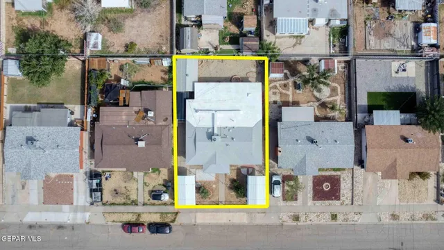 an aerial view of residential house with outdoor space and swimming pool