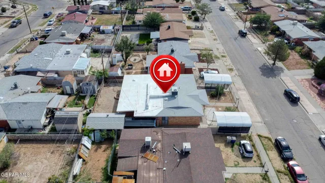 an aerial view of houses with outdoor space