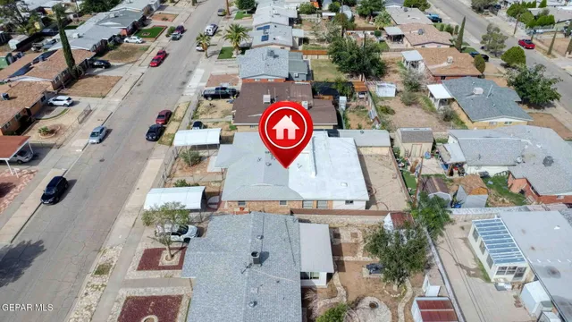 an aerial view of residential house with outdoor space and seating area