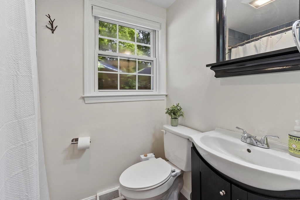 6 Edith Road Hudson, MA 01749 - Photo 15 of 30 a bathroom with a sink a toilet and a mirror