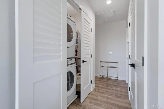 a view of a hallway with washer and dryer