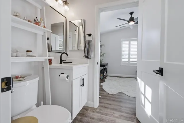 a bathroom with a sink toilet tub and shower