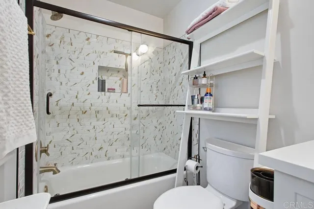 a bathroom with a shower and a toilet