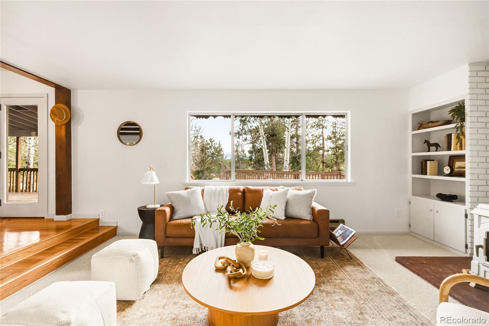 34657 Mohawk Trail Pine, CO 80470 - Photo 15 of 46 a living room with furniture and a large window