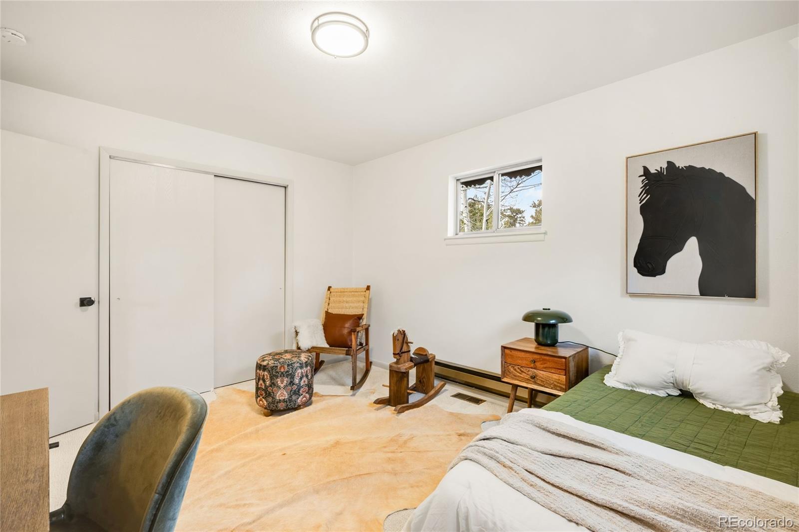34657 Mohawk Trail Pine, CO 80470 - Photo 27 of 46 a room with two bed and a view of living room