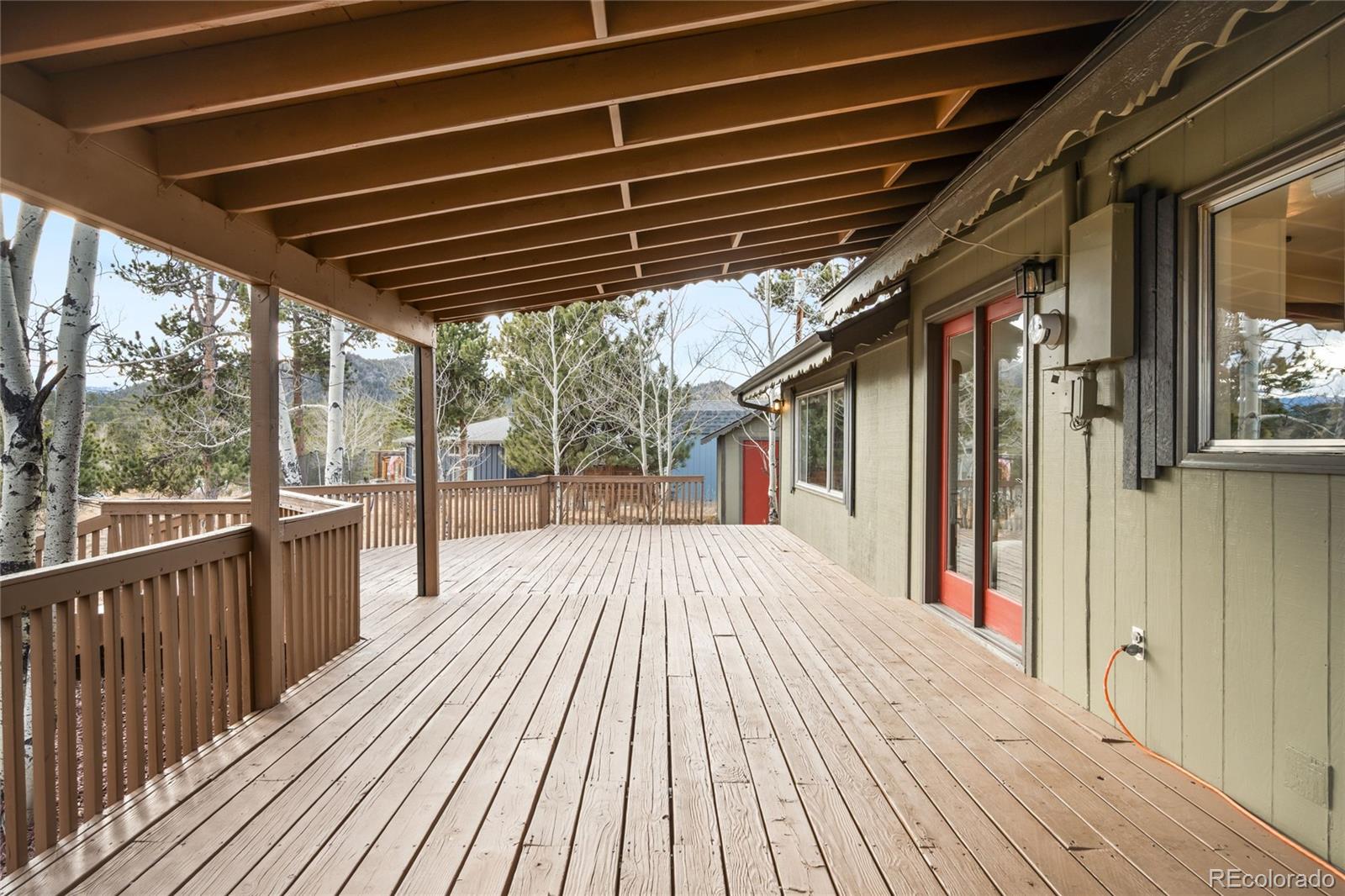 34657 Mohawk Trail Pine, CO 80470 - Photo 32 of 46 a view of porch with deck and wooden floor