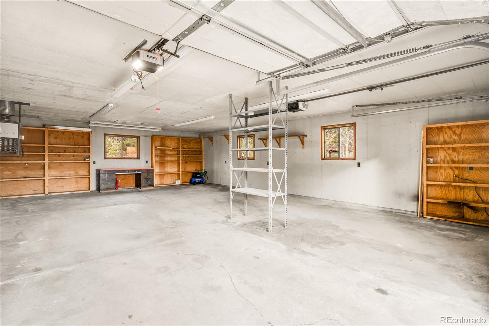 34657 Mohawk Trail Pine, CO 80470 - Photo 37 of 46 an empty room with furniture and windows