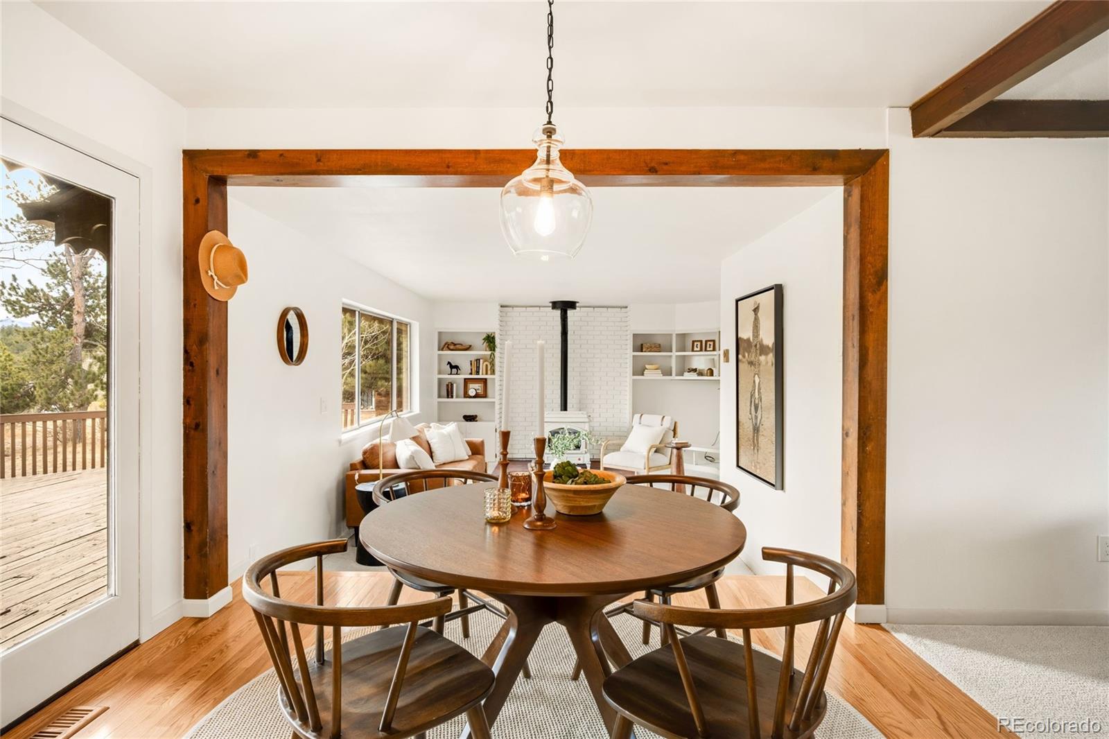 34657 Mohawk Trail Pine, CO 80470 - Photo 10 of 46 a view of a dining room with furniture and window