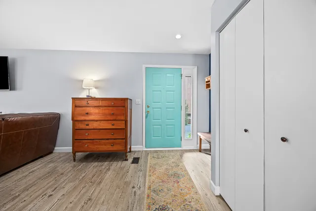 a room with furniture and a wooden floor