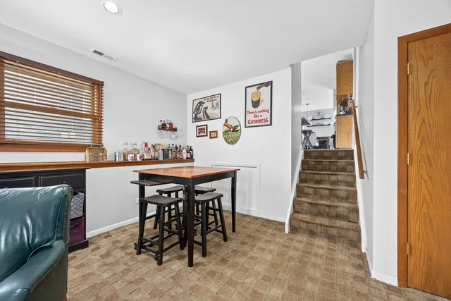 a dining room with furniture and entryway