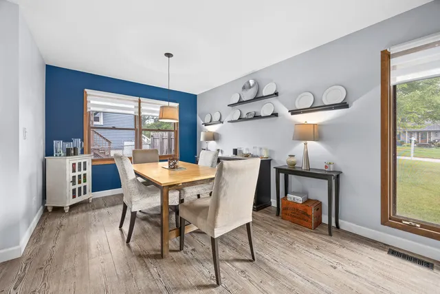 a view of a dining room with furniture window and wooden floor