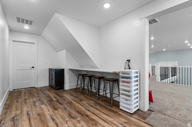 1426 South 1450th Street West Mapleton, UT 84664 - Photo 28 of 50 Versatile loft area featuring wood-finish flooring, a built-in counter surface, recessed lighting, and a solid core door