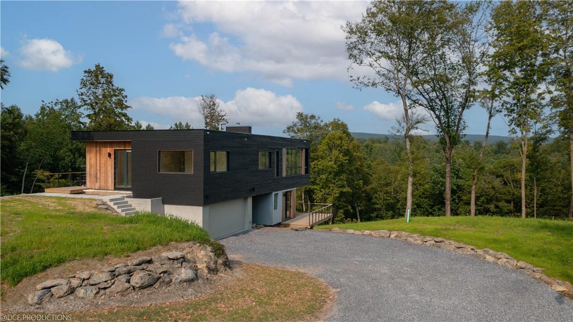 944 Cold Spring Road Clinton Corners, NY 12514 - Photo 1 of 1 Actual photo - Driveway approach, set high and cantilevered for a treetop perspective