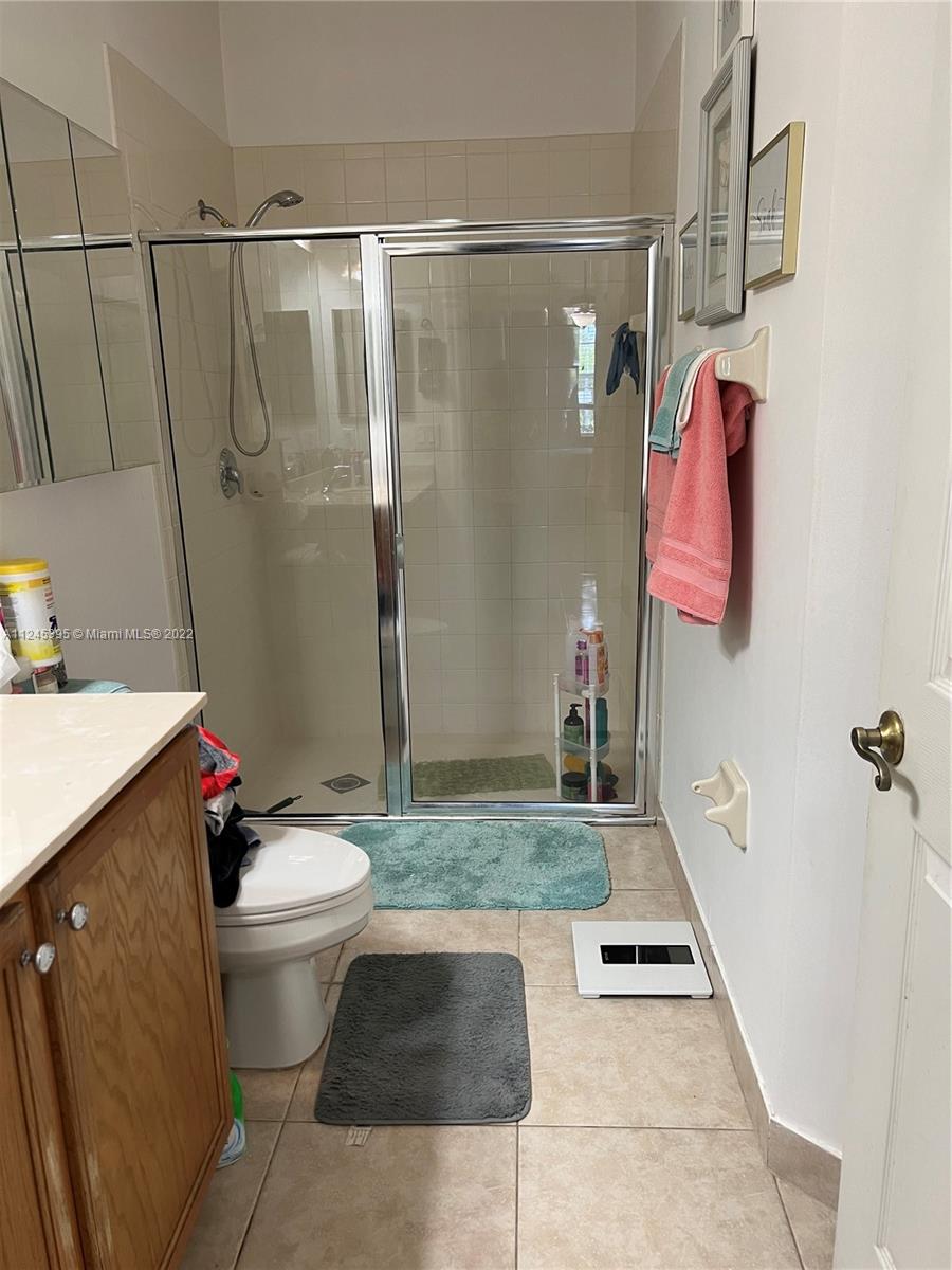 Hampton Hills Condominiums Tamarac, FL 33321 - Photo 10 of 24 a bathroom with a sink toilet and shower