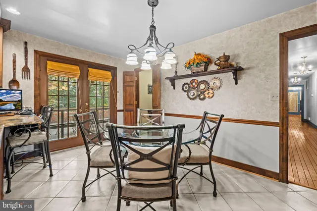 a kitchen with stainless steel appliances granite countertop a stove a sink dishwasher and a refrigerator