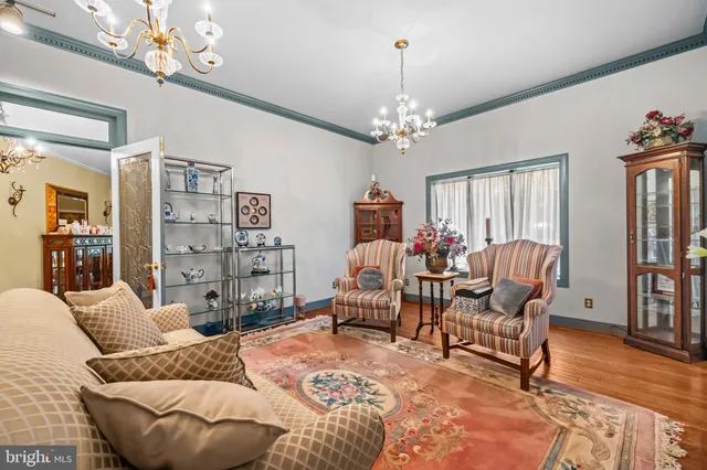 a view of a livingroom with furniture window and wooden floor