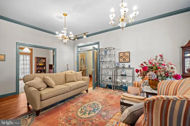 a living room with furniture fireplace and flat screen tv