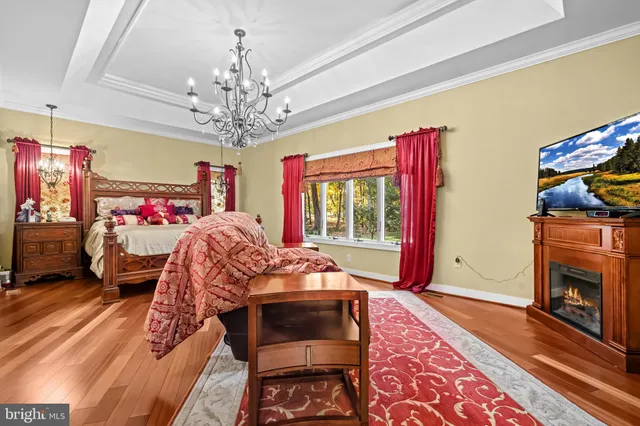 a bedroom with a bed and a fireplace