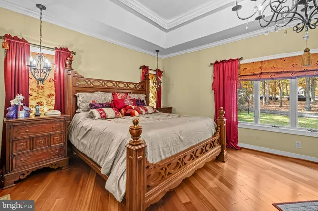 a spacious bedroom with a bed and a fireplace