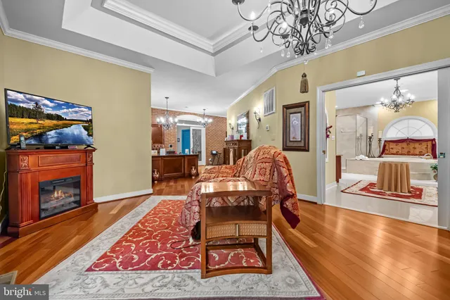 a spacious bathroom with a granite countertop sink a mirror a shower and a bathtub