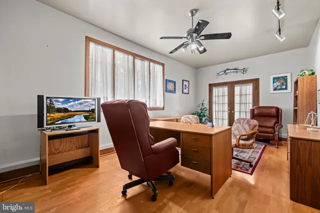 view of a house with a yard and sitting area