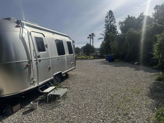 a pathway of a house with a yard