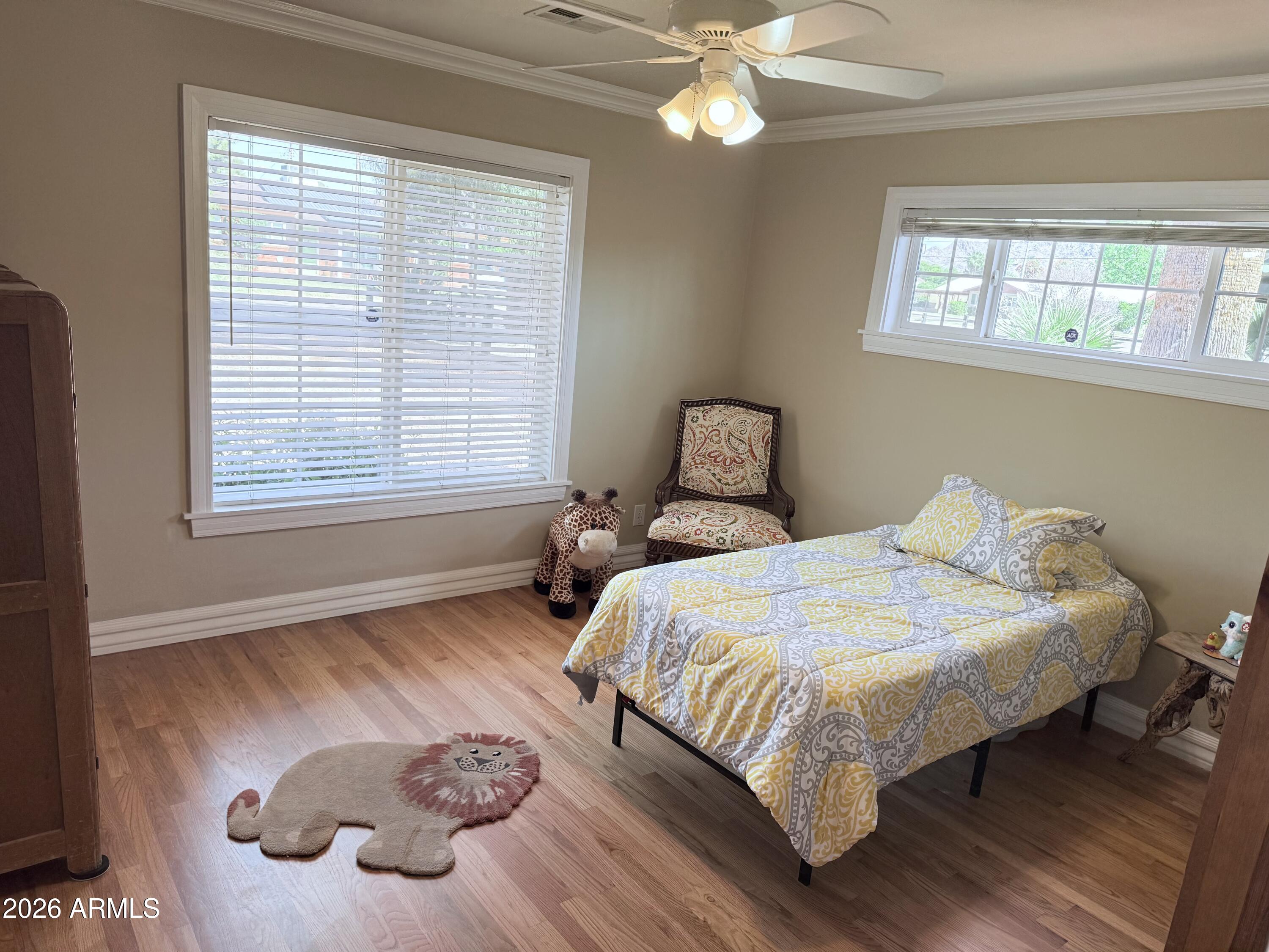 1135 East Lawrence Road Phoenix, AZ 85020 - Photo 11 of 23 a bedroom with bed and a window