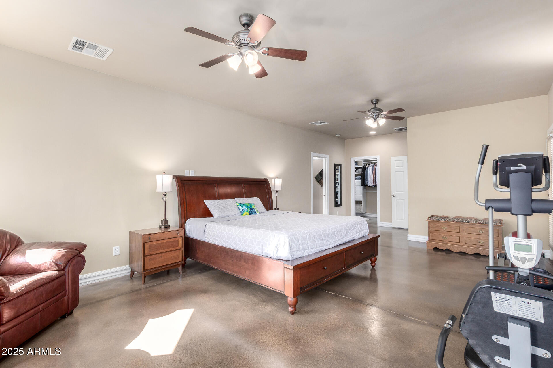 1135 East Lawrence Road Phoenix, AZ 85020 - Photo 15 of 23 a spacious bedroom with a bed and a chandelier