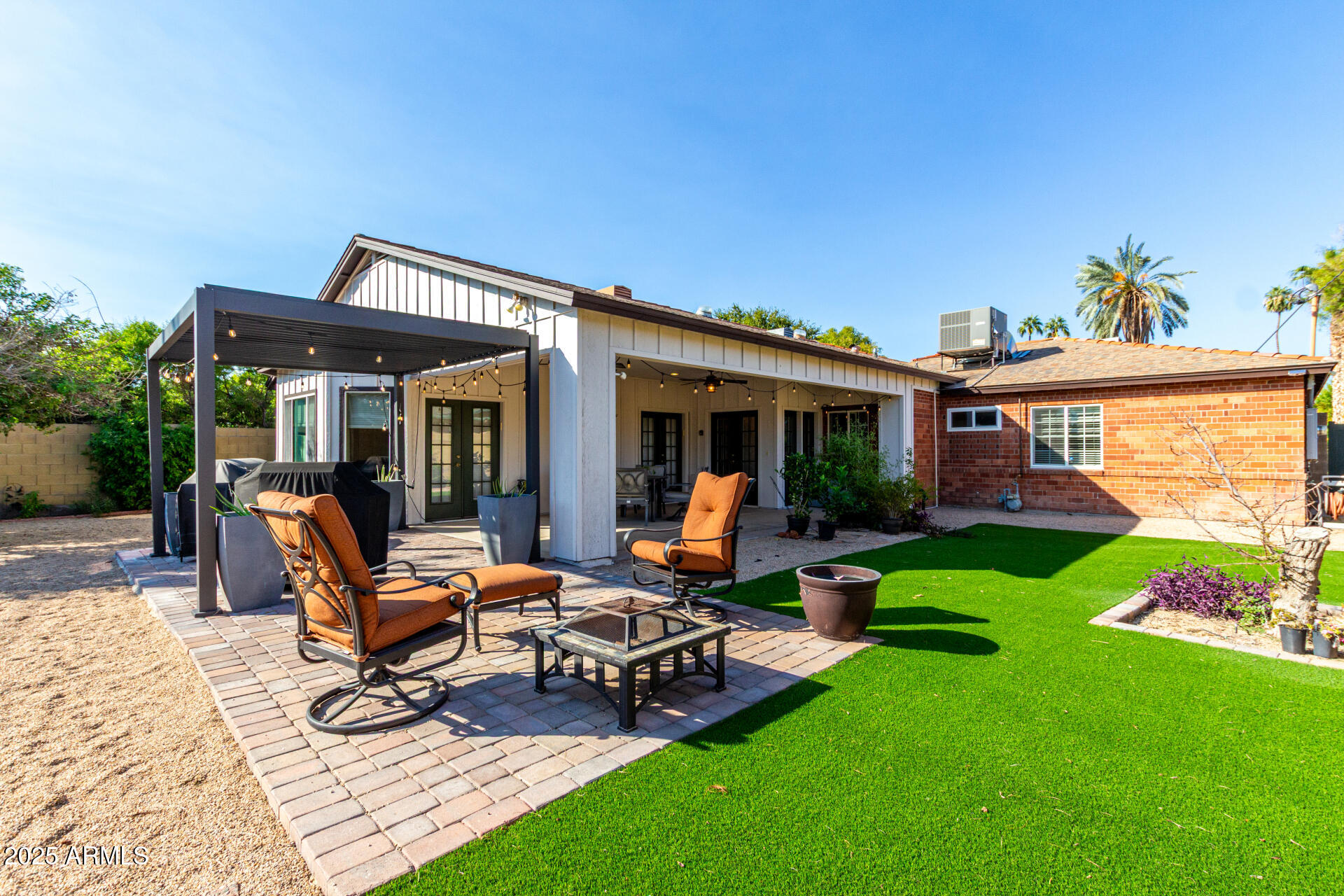 1135 East Lawrence Road Phoenix, AZ 85014 - Photo 18 of 18 a view of a house with backyard porch and sitting area