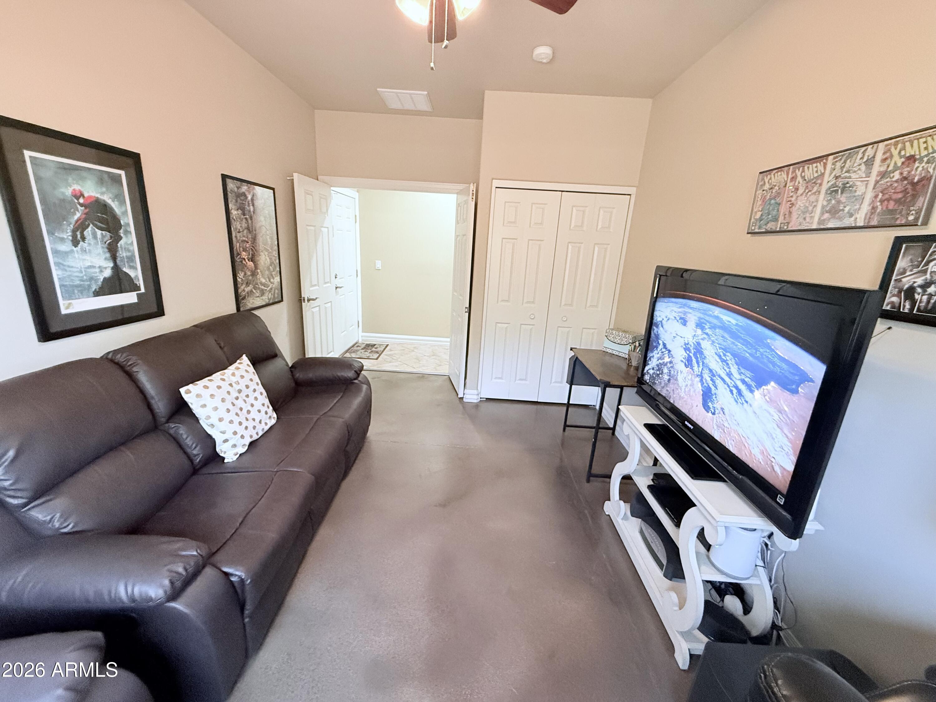 1135 East Lawrence Road Phoenix, AZ 85020 - Photo 19 of 23 a living room with furniture and a flat screen tv