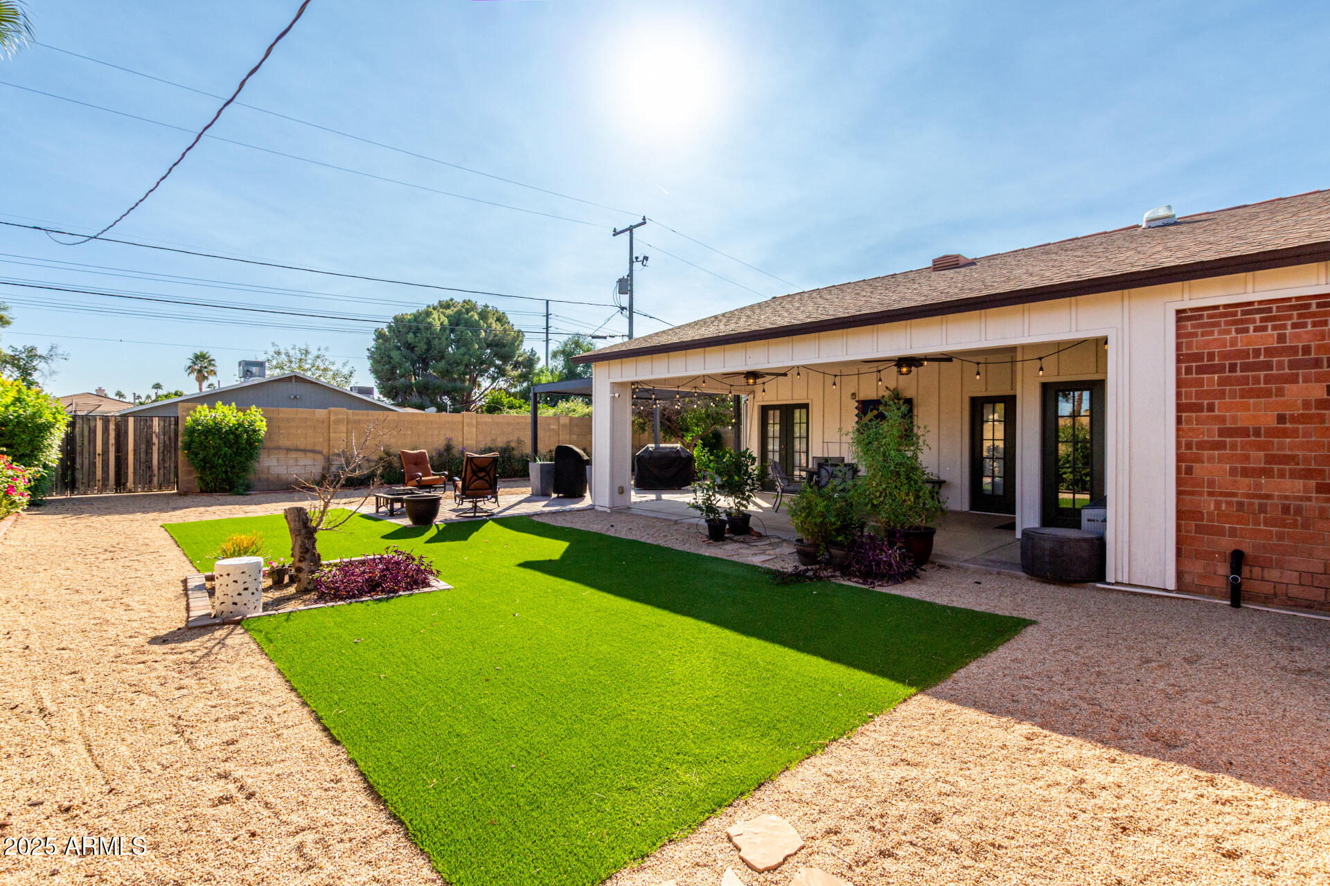 1135 East Lawrence Road Phoenix, AZ 85020 - Photo 22 of 23 a view of a house with swimming pool and porch