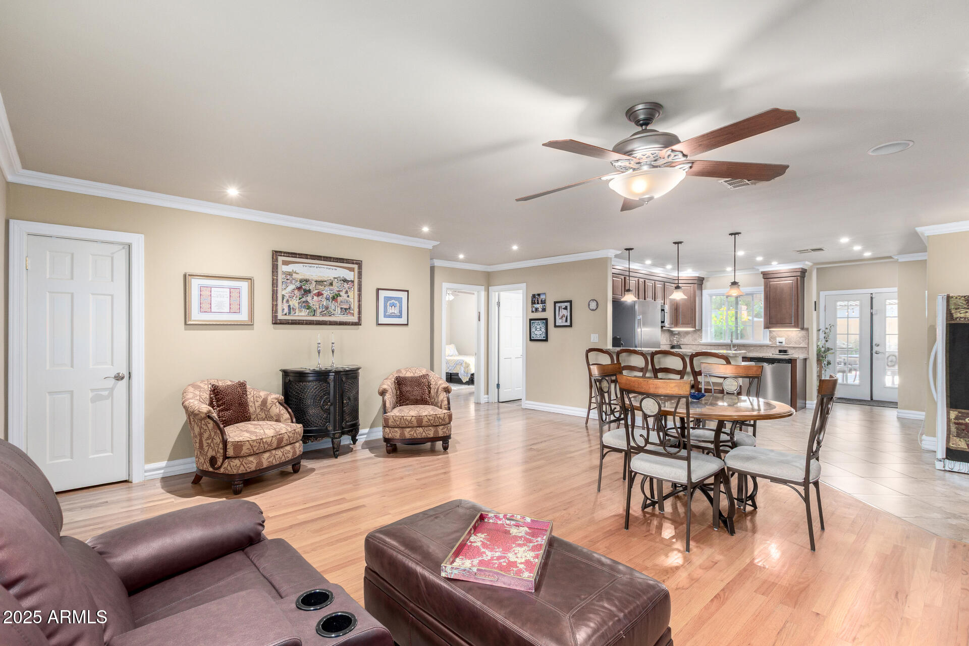 1135 East Lawrence Road Phoenix, AZ 85014 - Photo 3 of 18 a living room with furniture kitchen view and a chandelier