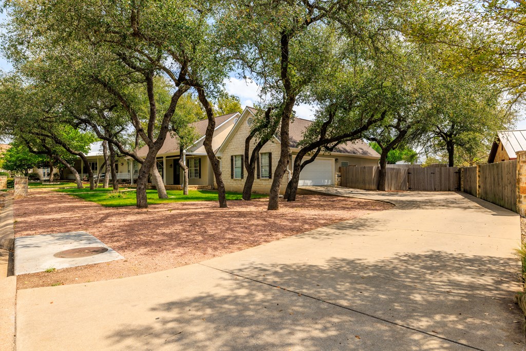 2211 Hedgestone Fredericksburg, TX 78624 - Photo 4 of 5 a house with trees in front of it