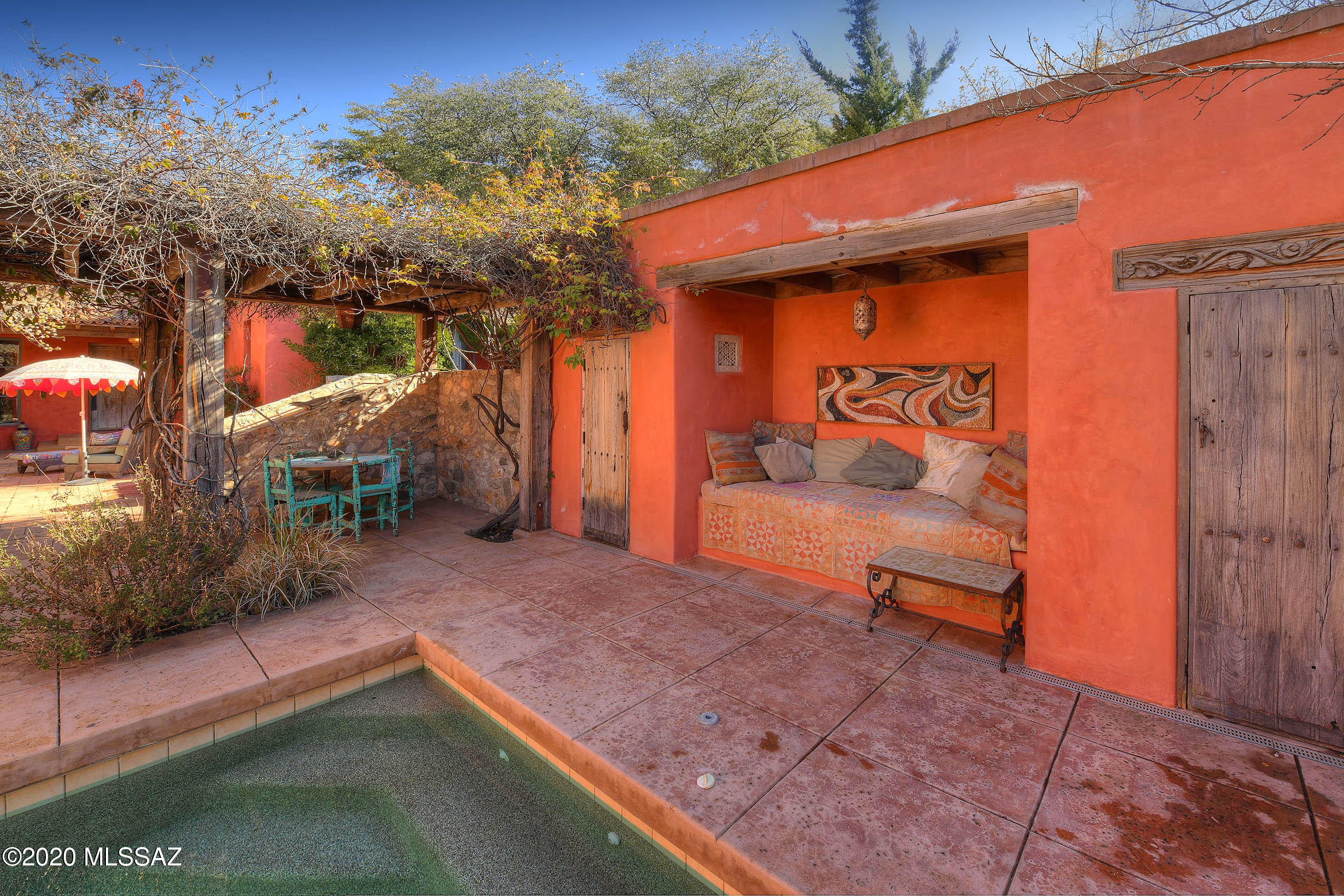 360 Harshaw Creek Road Patagonia, AZ 85624 - Photo 10 of 50 a backyard of a house with yard and outdoor seating