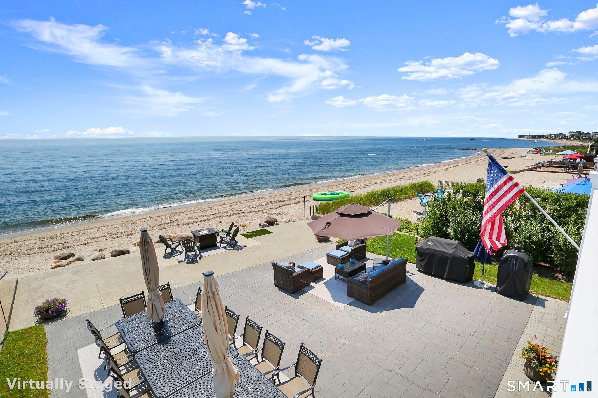 View from wraparound deck (shown here w/ former patio & outdoor furniture arrangement)